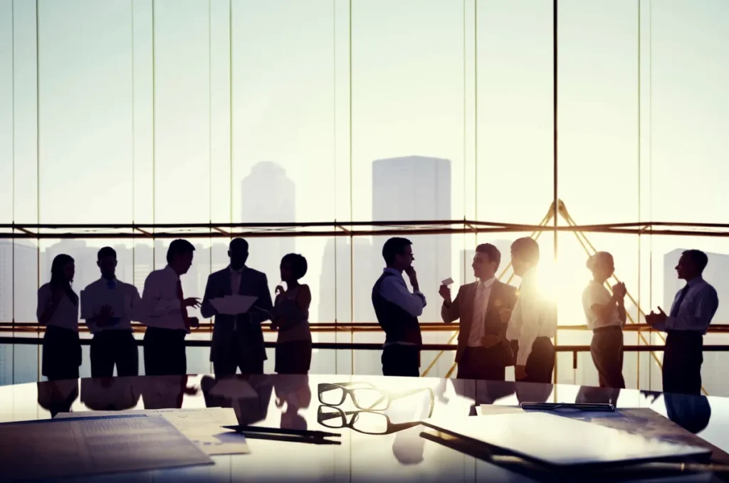 Team meeting in an office with large glass windows